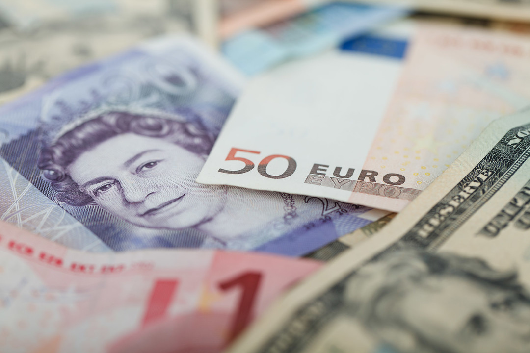 A mixture of banknotes, including euro and pound notes